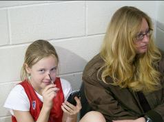 Sabrina and Mom "watching" Pierce's basketball game